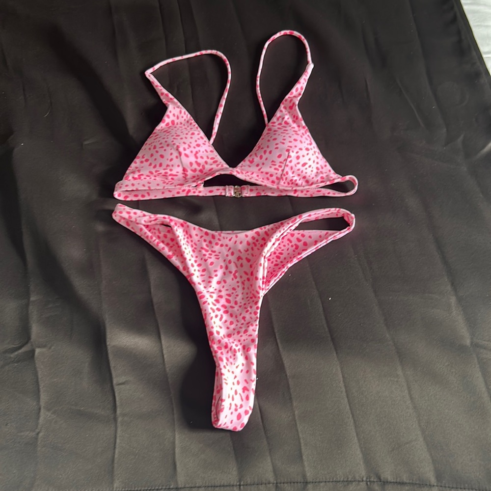 Spotted pink bikini set, bottoms are thong like and high rise